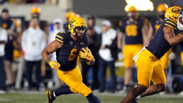 Nov 19, 2022; Berkeley, California, USA; California Golden Bears running back Jaydn Ott (6) carries the ball against the Stanford Cardinal during the fourth quarter at FTX Field at California Memorial Stadium. Mandatory Credit: Darren Yamashita-USA TODAY Sports  
